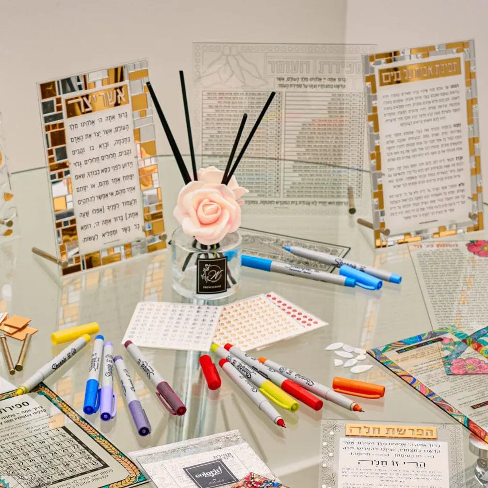 Blush Bloom Diffuser by Waterdale Collection displayed on desk with planner, markers, and organized workspace accessories