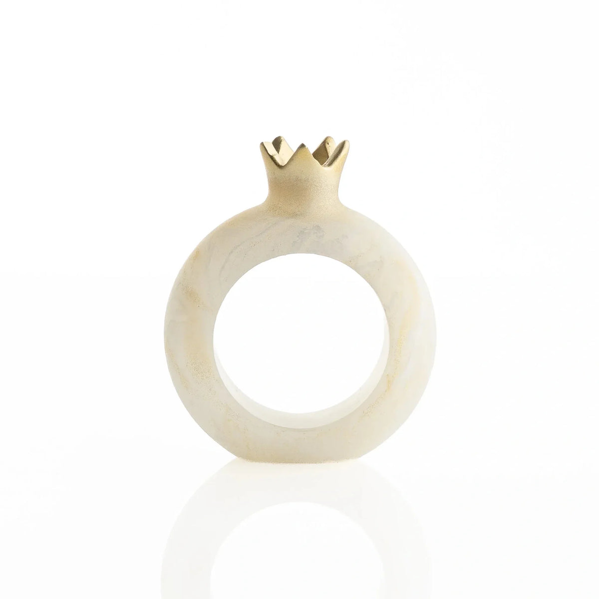 Gold resin pomegranate napkin rings styled on a holiday table setting
