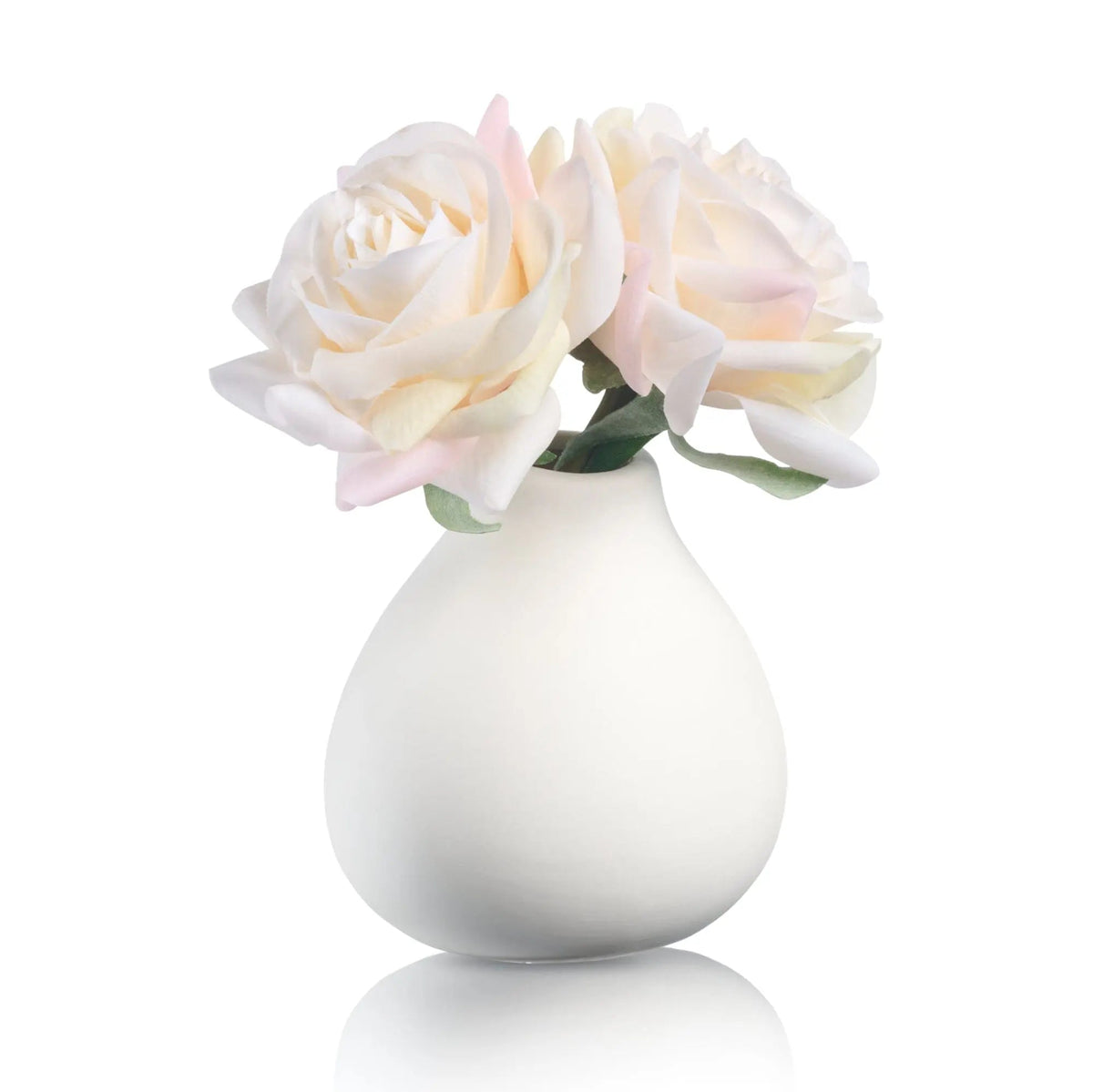 White teardrop vase with pale pink faux roses and greenery, elegant tabletop floral arrangement by Waterdale Collection.