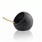 Black resin salt cellar with wooden spoon by Waterdale Collection, perfect for tabletop serving and entertaining.
