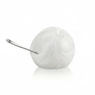 White resin salt cellar with metal spoon by Waterdale Collection, elegant tabletop accessory for dining and entertaining.