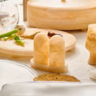 Amber resin salt shaker set with matching tray on wooden surface, featuring translucent honey-colored design ideal for table settings and entertaining.