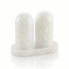 Pair of white resin salt shakers with matching tray, modern cylindrical design for tabletop dining and hostess gifting.