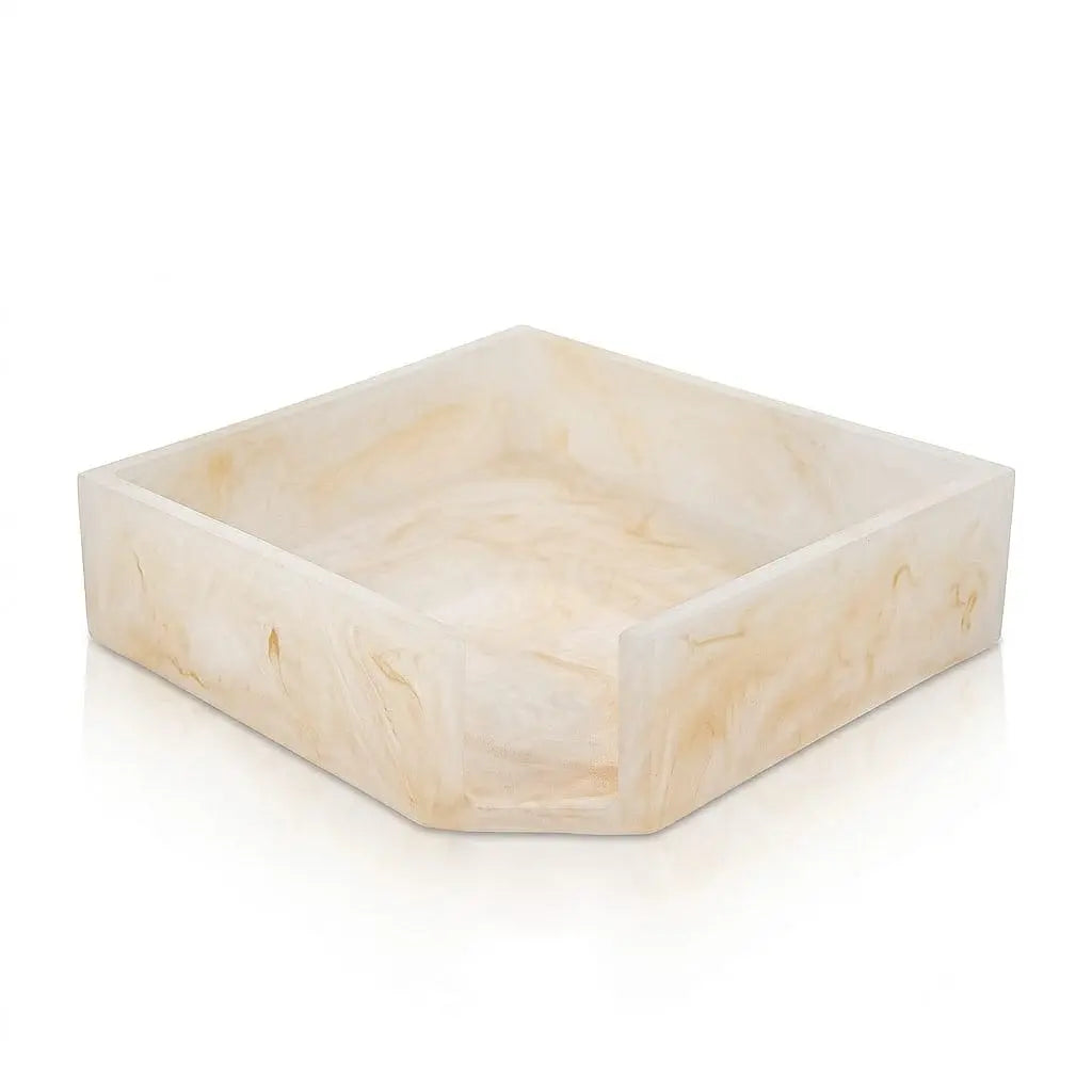 Square cream-colored resin napkin holder with natural stone-like texture, perfect for Pesach tabletop entertaining