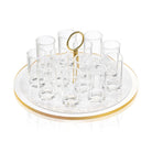 Classic Pearlstone liquor set with eight clear glasses arranged around a central gold-handled serving tray on white pearl marble base