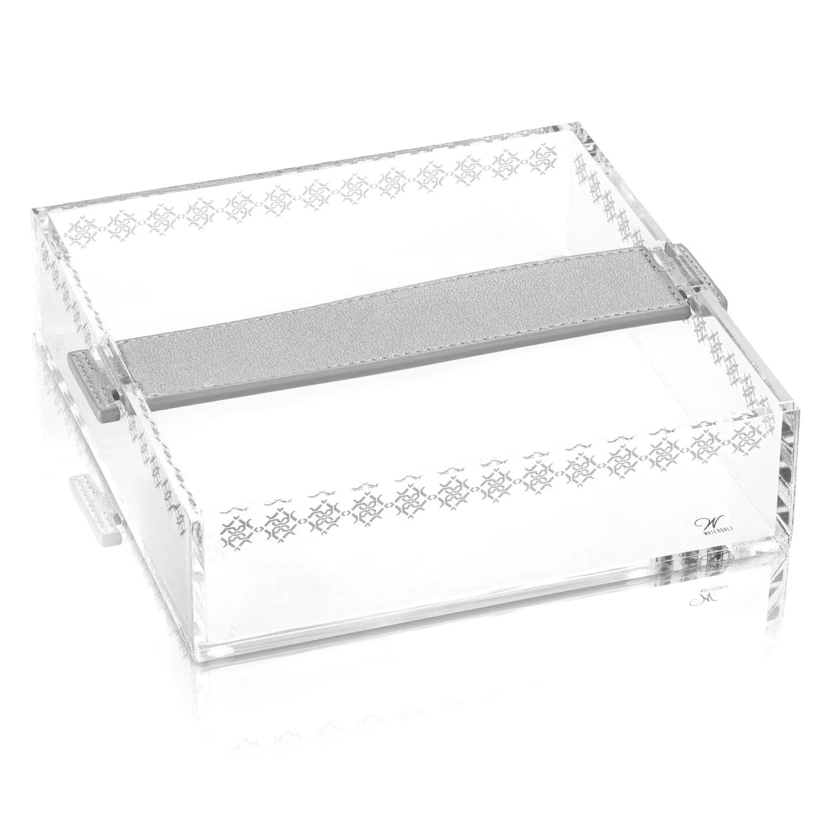 Clear acrylic napkin holder with metallic leather strap design by Waterdale Collection, featuring geometric pattern bands and chrome accents
