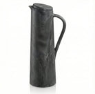 Charcoal gray resin pitcher with textured twig-inspired pattern and curved handle, ideal for Passover entertaining and tabletop décor.