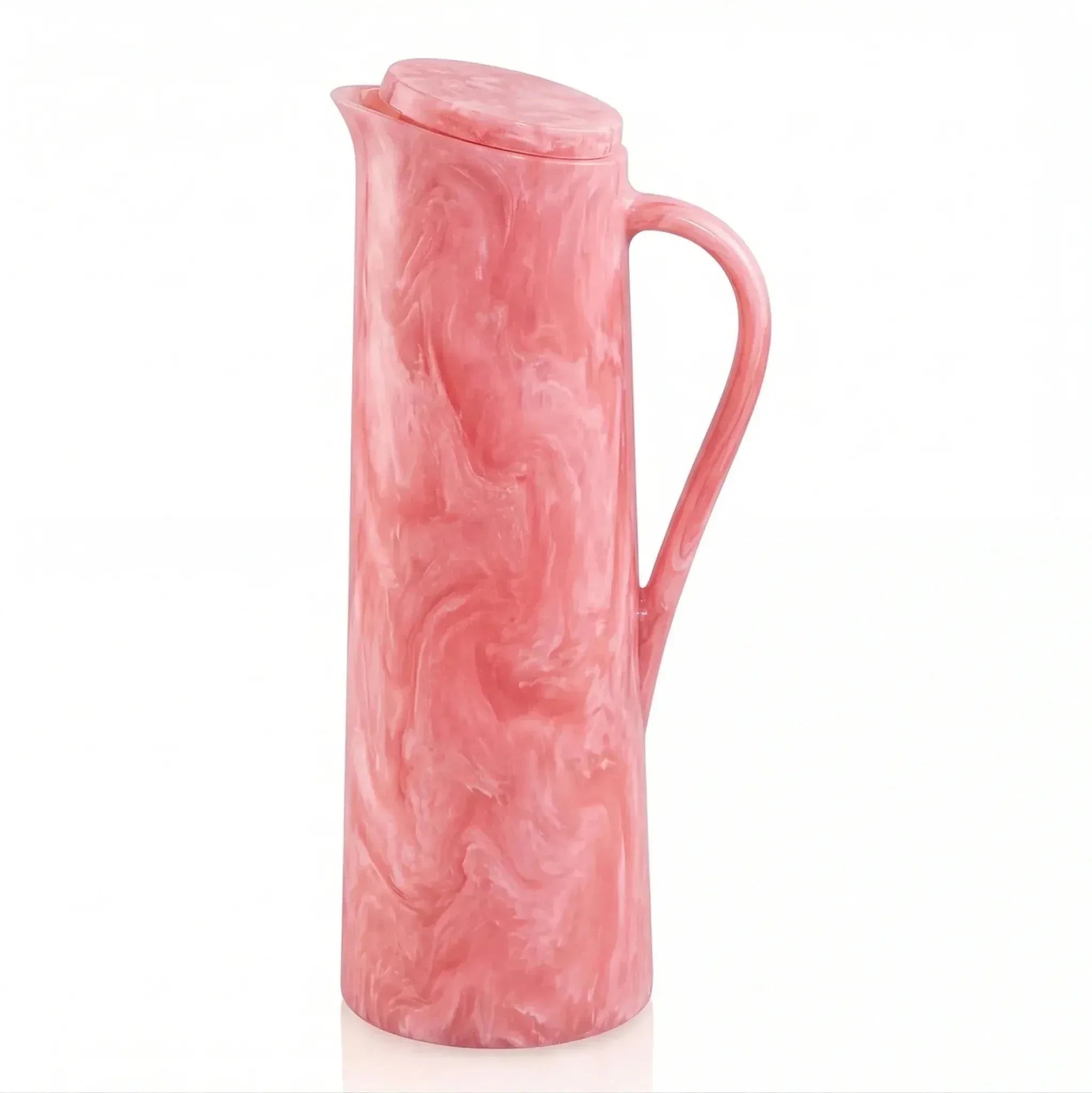Pink resin pitcher with textured surface and curved handle from Waterdale Collection's tabletop collection.