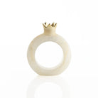 Gold resin pomegranate napkin rings styled on a holiday table setting