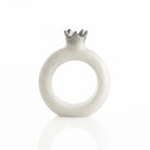 Silver resin pomegranate napkin rings framing napkins at each seat
