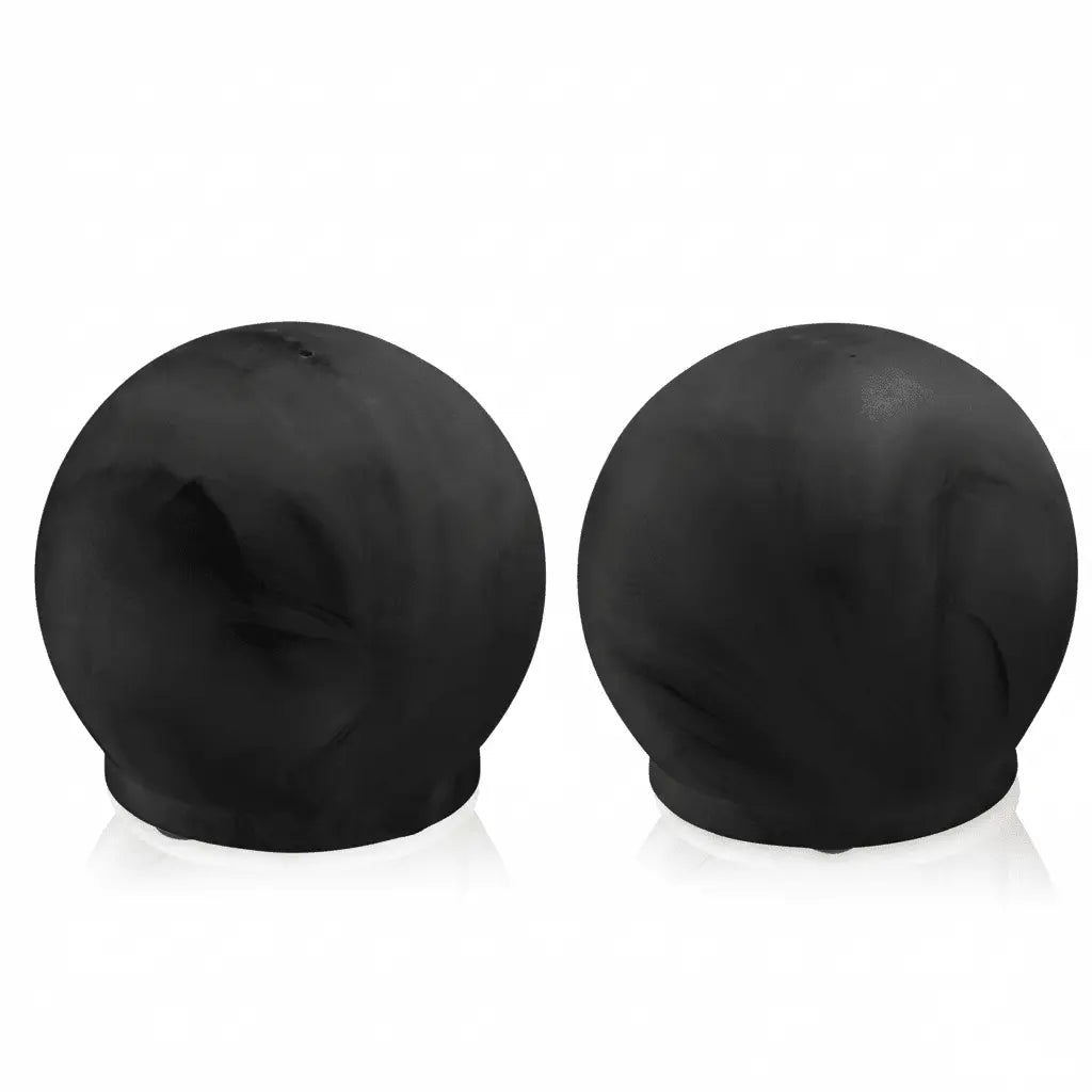 Pair of black resin salt shakers with rounded dome tops from Waterdale Collection's modern tabletop collection