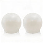 Pair of white resin salt shakers with rounded dome tops from Waterdale Collection's metallic pesach tabletop collection.