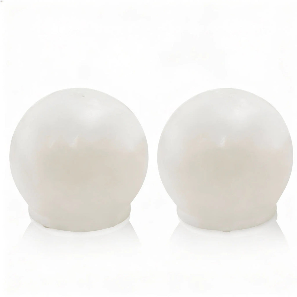 Pair of white resin salt shakers with rounded dome tops from Waterdale Collection's metallic pesach tabletop collection.