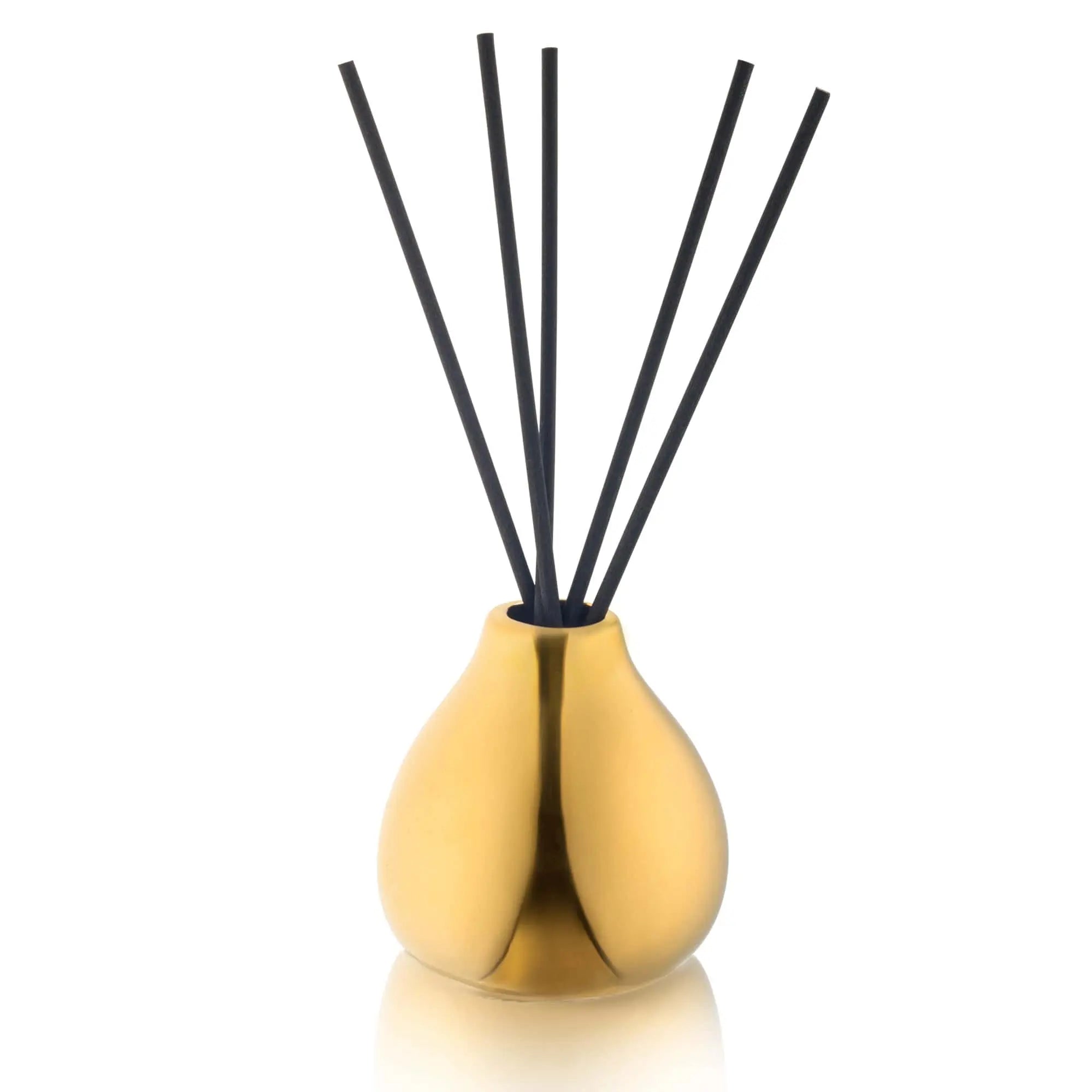 Teardrop-shaped gold reed diffuser with black sticks in a tall bottle, perfect for home fragrance and decor.